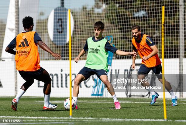 Arda Güler player of Real madird is training with teammates Nacho Fernandez and Vinicius Junior at Valdebebas training ground on September 25, 2023...