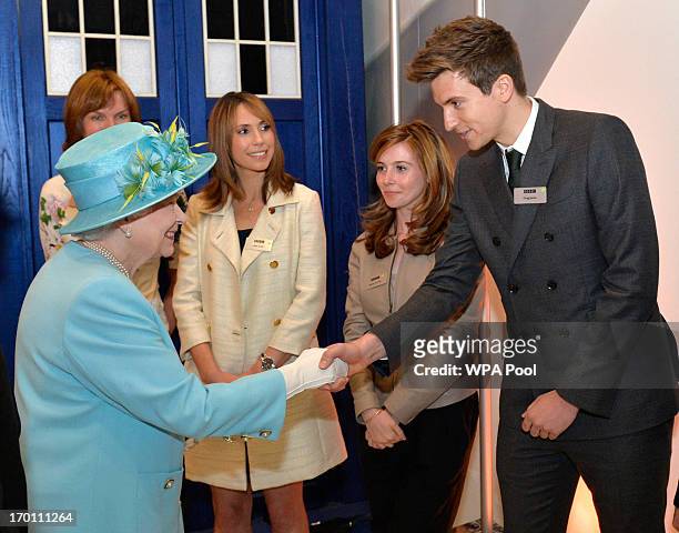 Queen Elizabeth II meets radio rpesenter Greg James as she opens the new BBC Broadcasting House on June 7, 2013 in London, England.