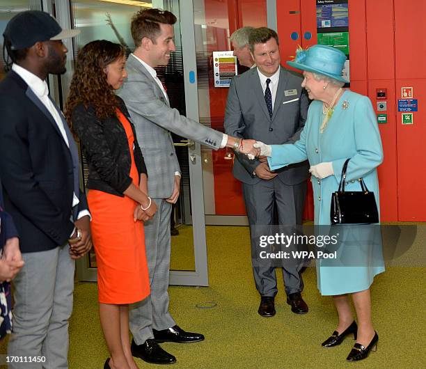 Queen Elizabeth II meets radio DJ Nick Grimshaw as she opens the new BBC Broadcasting House on June 7, 2013 in London, England.