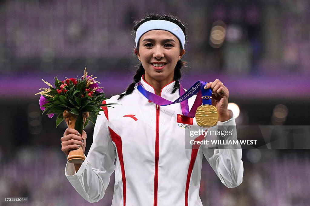 Lin Yuwei Sprinter Gold medallist China's Lin Yuwei celebrates on the podium during the ...