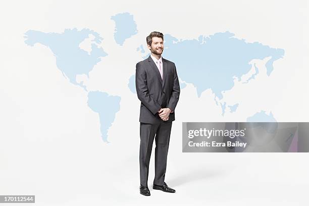 businessman standing with world map. - fato completo imagens e fotografias de stock