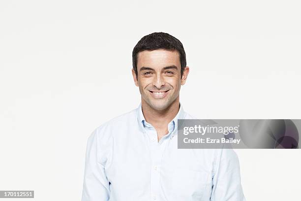 mixed race man smiling. - mixed race man standing studio stockfoto's en -beelden
