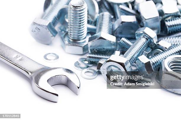 wrench with nuts and bolts - screw stock pictures, royalty-free photos & images