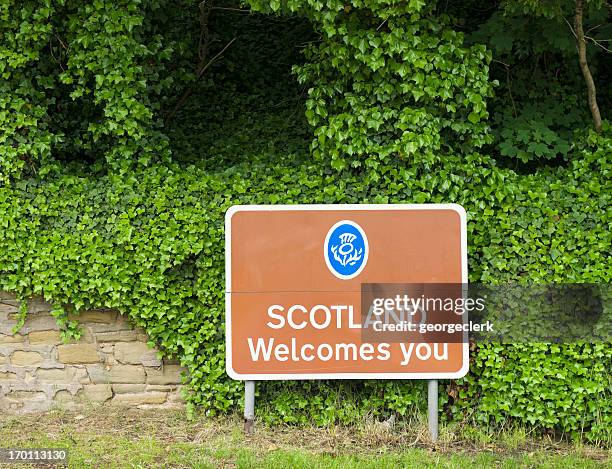 "scotland welcomes you" border sign - scotland stock pictures, royalty-free photos & images