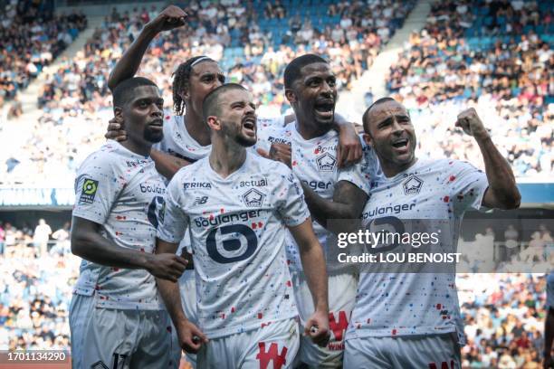 Lille's players celebrate the own goal by Le Havre's French defender Yoann Salmier during the French L1 football match between Le Havre AC and Lille...