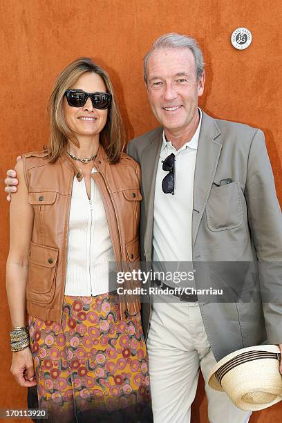 Of newspaper L'Opinion Christophe Chenut and his wife sighting at Roland Garros Tennis French Open 2013 - Day 13 on June 7, 2013 in Paris, France.