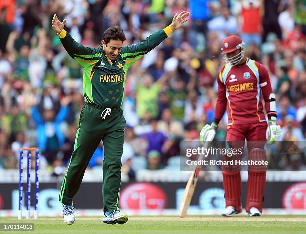 Saeed Ajmal of Pakistan celebrates taking the wicket of Chris Gayle of West Indies during the ICC Champions Trophy group B match between West Indies...