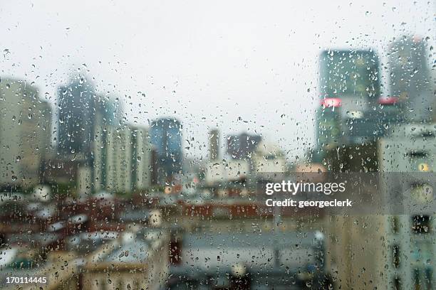 gloomy city rain - window rain stock pictures, royalty-free photos & images