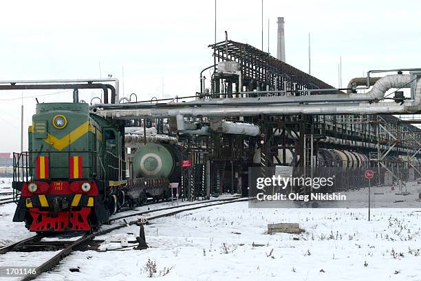 Railway tanks are shown before oil is loaded into the containers at the oil refinery of Canadian oil company Hurricane Kumkol Munai December 20, 2002...