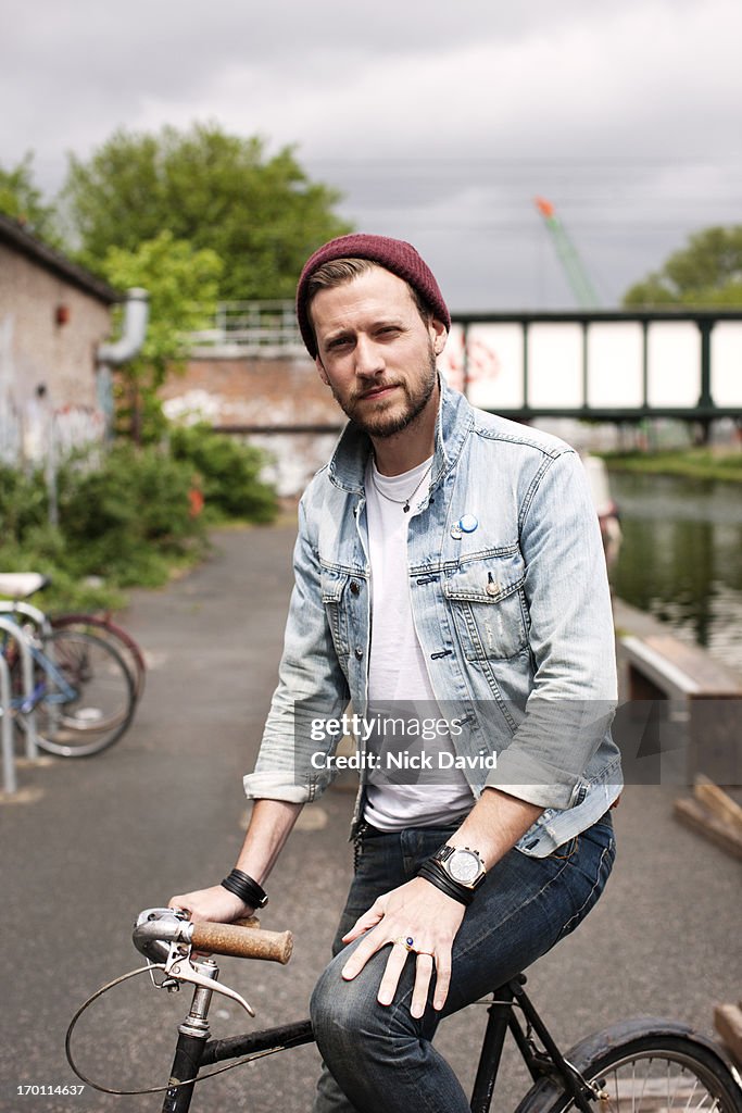 Portrait of a young man on his bike