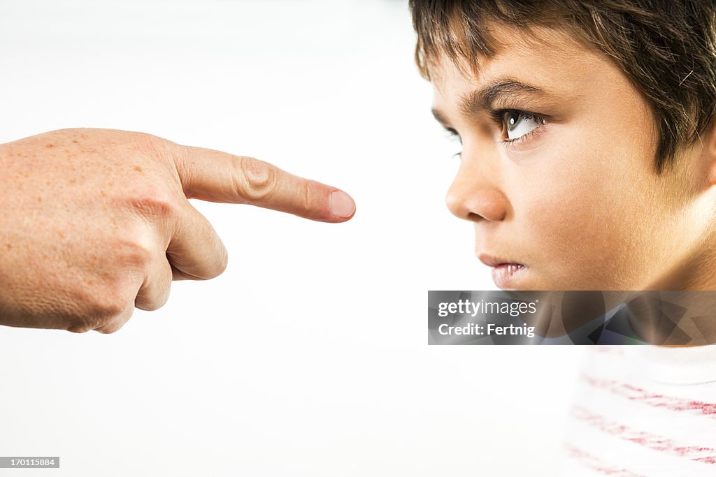 Defiant child being disciplined.