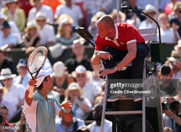 Novak Djokovic of Serbia appeals to the chair umpire Pascal Maria during the men's singles semi-final match against Rafael Nadal of Spain on day...