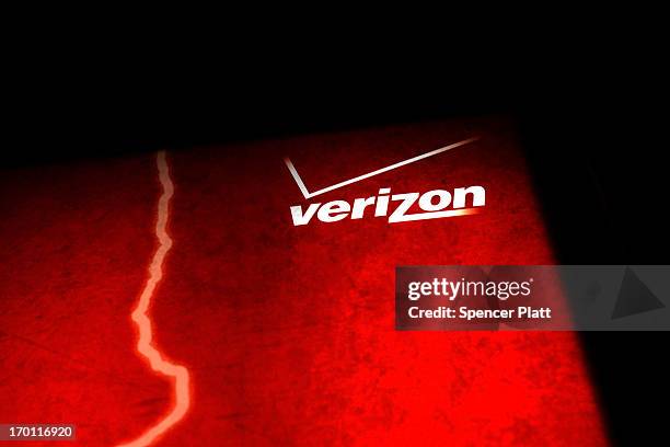 Verizon advertisement is viewed outside of a store on June 7, 2013 in New York City. In a statement today U.S. President Barack Obama defended the...