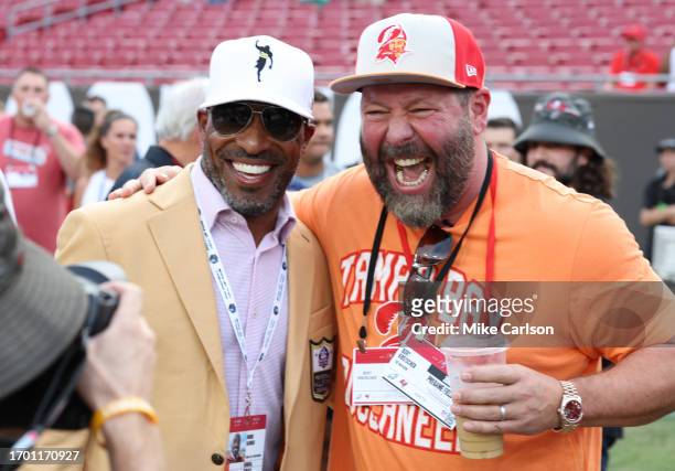 Hall of famer Ronde Barber and comedian Bert Kreischer are seen on the field prior to a game between the Tampa Bay Buccaneers and the Philadelphia...