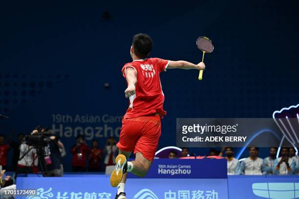 China's Weng Hongyang reacts after his win against India's Mithun Manjunath at the badminton men's team final match during the 2022 Asian Games in...