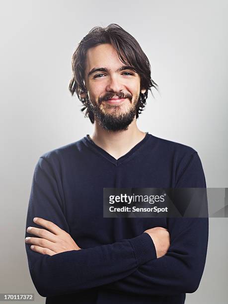 young man smiling - men long hair stock pictures, royalty-free photos & images