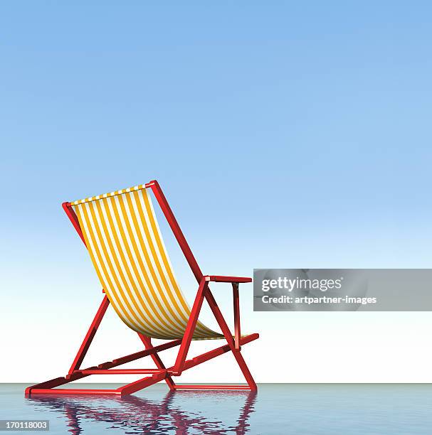 a red deck chair at the sea with blue sky - sedia a sdraio foto e immagini stock