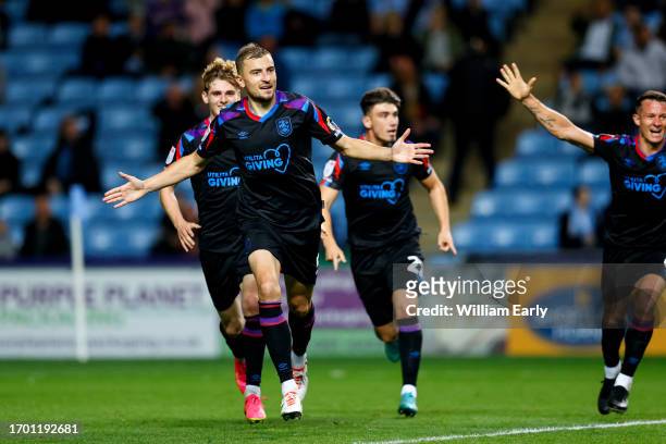 Michal Helik of Huddersfield Town celebrates after scoring a goal to make it 1-1 during the Sky Bet Championship match between Coventry City and...