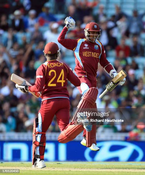 Denesh Ramdin and Kemar Roach of West Indies celebrate victory during the ICC Champions Trophy group B match between West Indies and Pakistan at The...