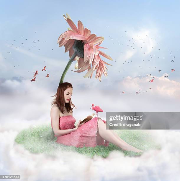 woman sitting on a cloud with grass under a flower reading - sitting on a cloud stock pictures, royalty-free photos & images