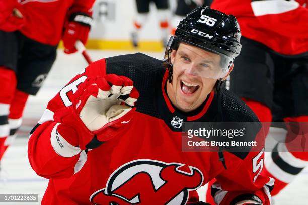 Erik Haula of New Jersey Devils waves to his son prior to the game against the Philadelphia Flyers during preseason at the Prudential Center on...