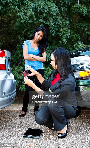insurance adjuster photographing damage to vehicle - car photo shoot stock pictures, royalty-free photos & images