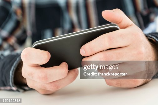 Man using a smartphone Man using a smartphone