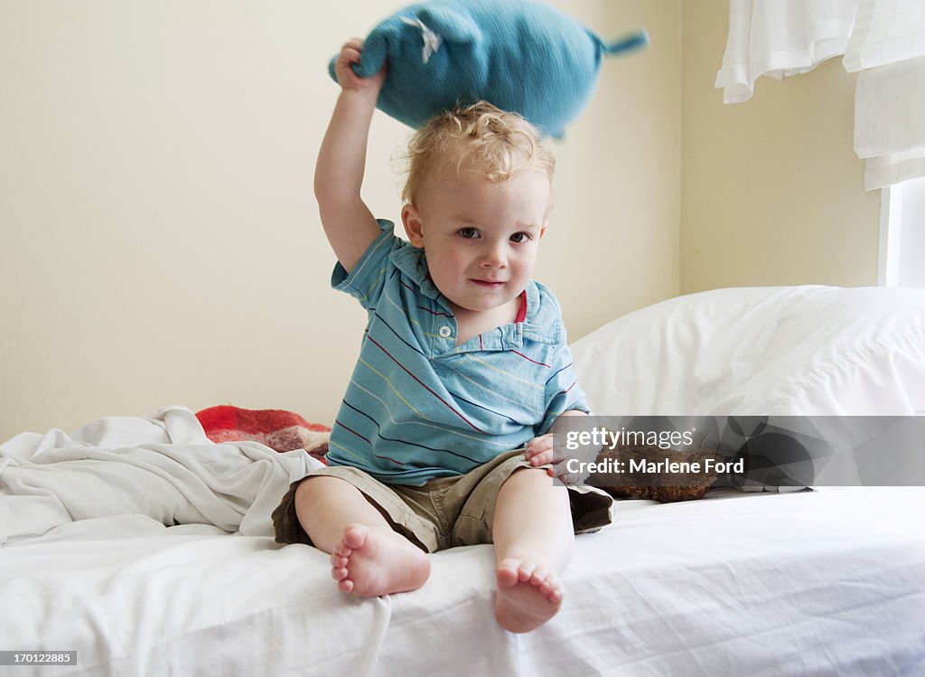 Toddler throwing a toy