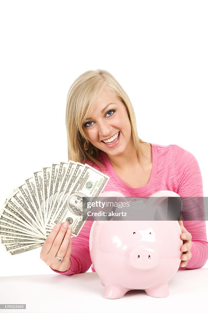 Happy blond woman holding money cash piggybank saving future isolated