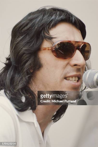 Welsh musician, composer, singer-songwriter and record producer John Cale, performing at Crystal Palace Garden Party, 7th June 1975.