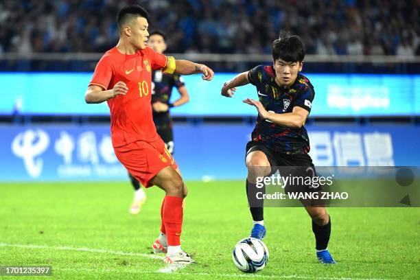 South Korea's Hwang Jaewon controls the ball during the men's quarter-final football match between South Korea and China at the Hangzhou 2022 Asian...