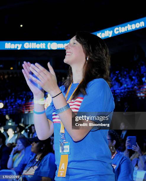 Attendee Kirsten Rackers, of Kentucky, dances during the Wal-Mart Stores Inc. Annual shareholders meeting in Fayetteville, Arkansas, U.S., on Friday,...