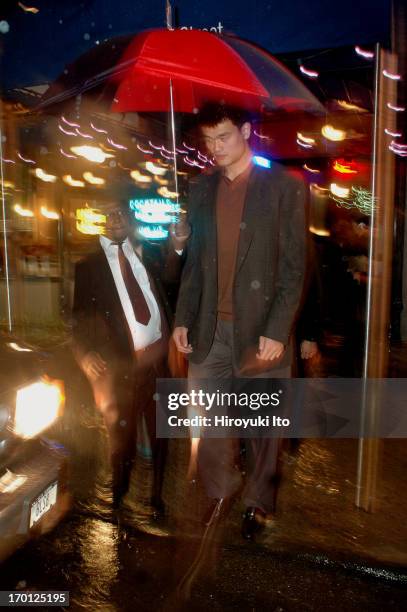 Yao Ming, the NBA star from China, leaving the restaurant Blue Smoke, on East 27th Street on Tuesday night, September 28, 2004.