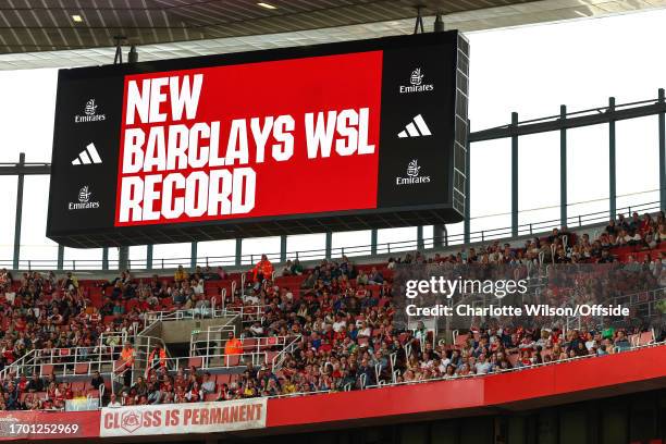 The big screens at The Emirates show the match attendance is a New Barclays WSL Record during the Barclays Women's Super League match between Arsenal...