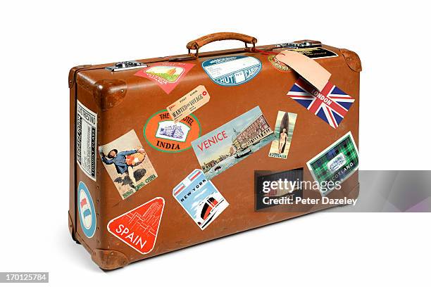 suitcase with travel stickers - stickers stockfoto's en -beelden