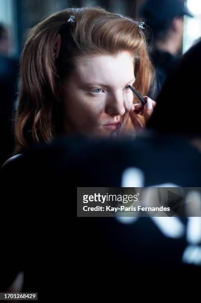 Model prepares backstage prior to the Weinsanto Womenswear Spring/Summer 2024 show as part of Paris Fashion Week on September 25, 2023 in Paris,...