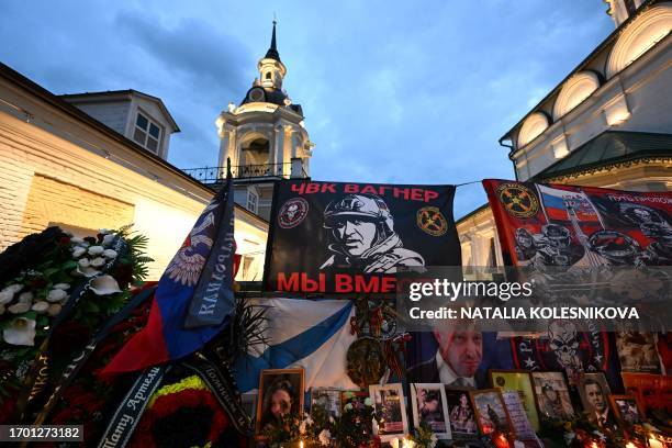 View of a makeshift memorial for Wagner private mercenary group chief Yevgeny Prigozhin in central Moscow on October 1 as people visit it to mark 40...