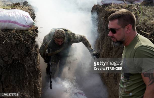 Medics, volunteers and military personnel undergo a tactical training, including first aid and the simulation of a wounded comrade evacuation, in the...
