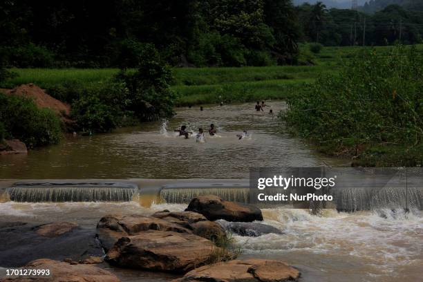 Local children are playing in the water near a rain water harvesting check dam at Ababda village in Gajapati district in the eastern ghat regions...