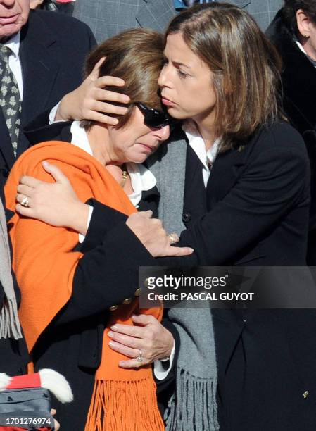 Julie , one of the two daughters of chairman of the French regional council of Languedoc Roussillon Georges Freche, hugs her mother Claudine during...
