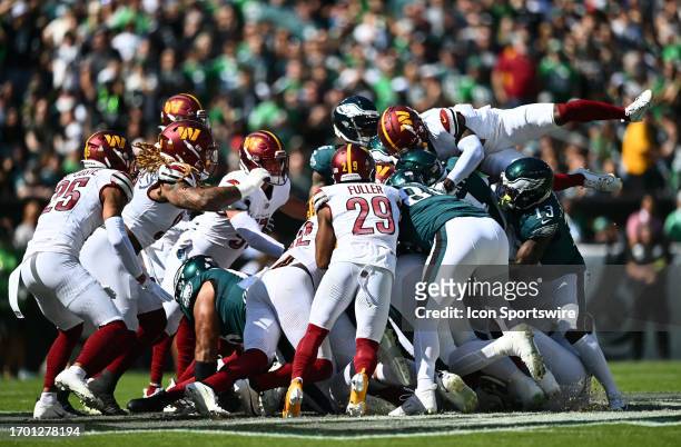 The Washington Commanders defense attempts to defend a QB sneak in the first half during the game between the Washington Commanders and Philadelphia...