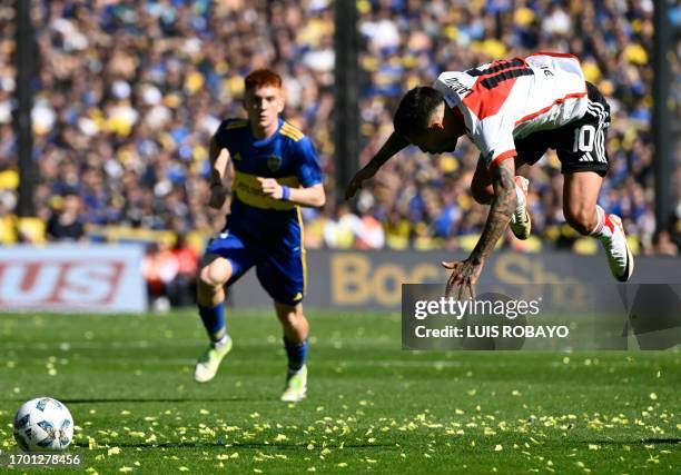 River Plate's midfielder Manuel Lanzini falls during the Argentine Professional Football League Tournament 2023 Superclasico match against Boca...