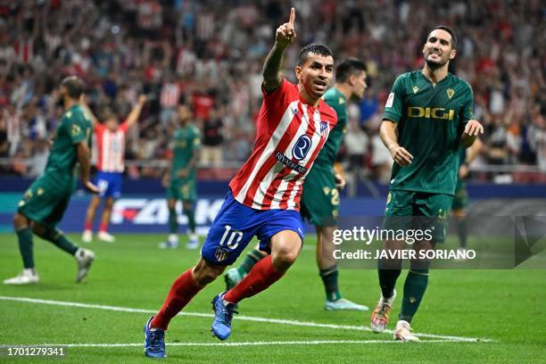 Atletico Madrid's Argentinian forward Angel Correa celebrates scoring his team's first goal during the Spanish Liga football match between Club...