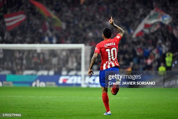 Atletico Madrid's Argentinian forward Angel Correa celebrates scoring his team's first goal during the Spanish Liga football match between Club...