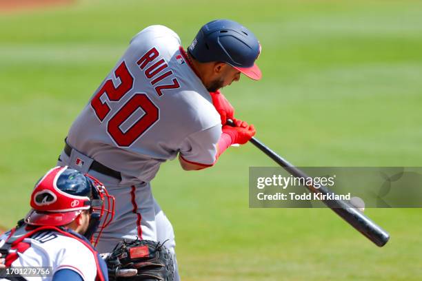 Keibert Ruiz of the Washington Nationals hits a ground rule double bringing-in two runs during the first inning against the Atlanta Braves at Truist...