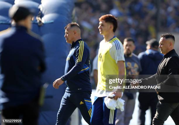Boca Juniors' team coach Jorge Almiron leaves the pitch after losing 2-0 against River Plate during the Argentine Professional Football League...