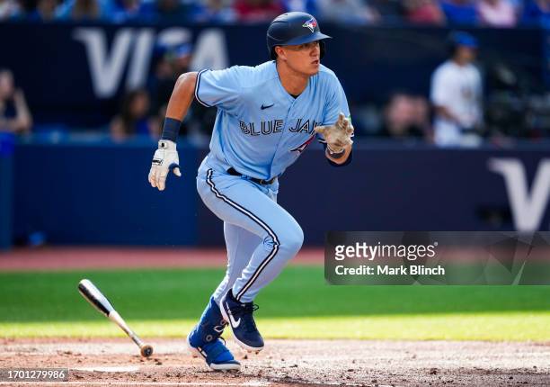 Cam Eden of the Toronto Blue Jays hits a single for his first Major League hit against the Tampa Bay Rays during the second inning in their MLB game...