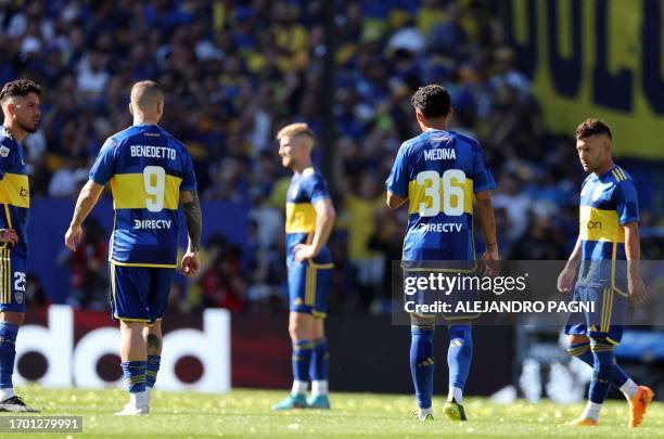 Boca Juniors players react after losing against River Plate during the Argentine Professional Football League Tournament 2023 Superclasico match at...