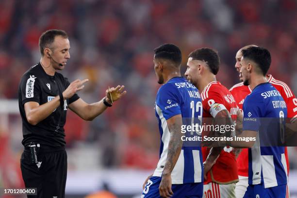 Referee Joao Pinhiero argues with Galeno of FC Porto, Eustaquio of FC Porto during the Portugese Primeira Liga match between Benfica v FC Porto at...
