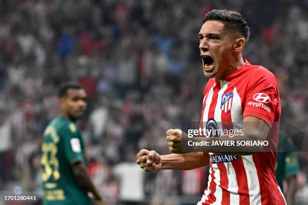 Atletico Madrid's Argentine defender Nahuel Molina celebrates scoring the equalizing goal during the Spanish Liga football match between Club...